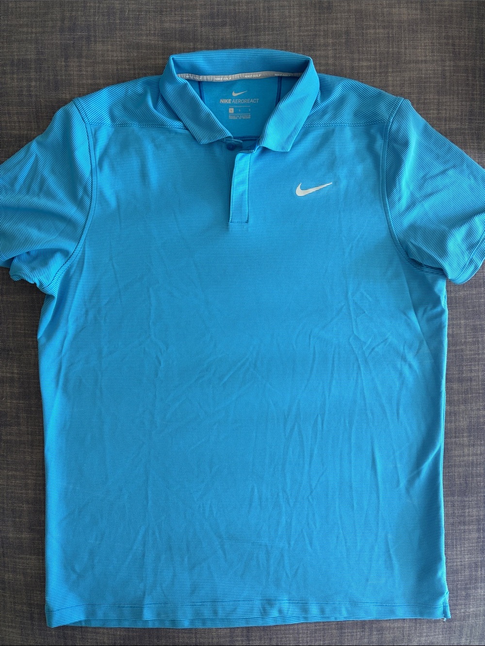 Nike Men’s Bright Turquoise Polo with White Swoosh